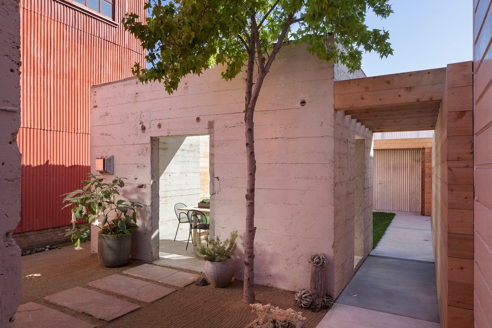 Contemporary backyard patio in San Francisco with concrete pavers and a gazebo/cabana.