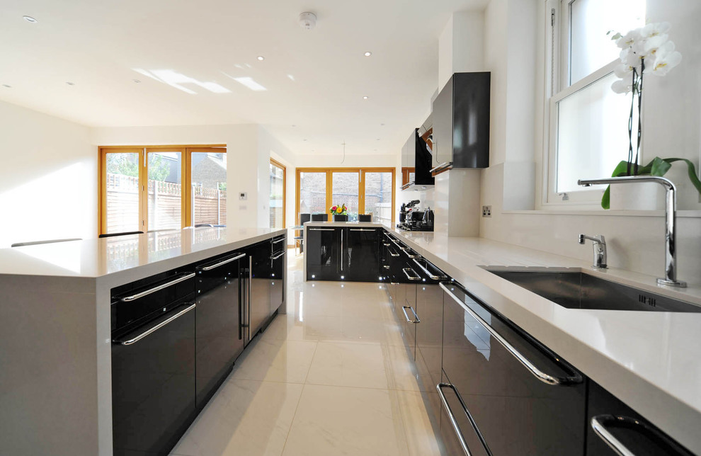 Design ideas for a modern kitchen in London with an undermount sink and flat-panel cabinets.