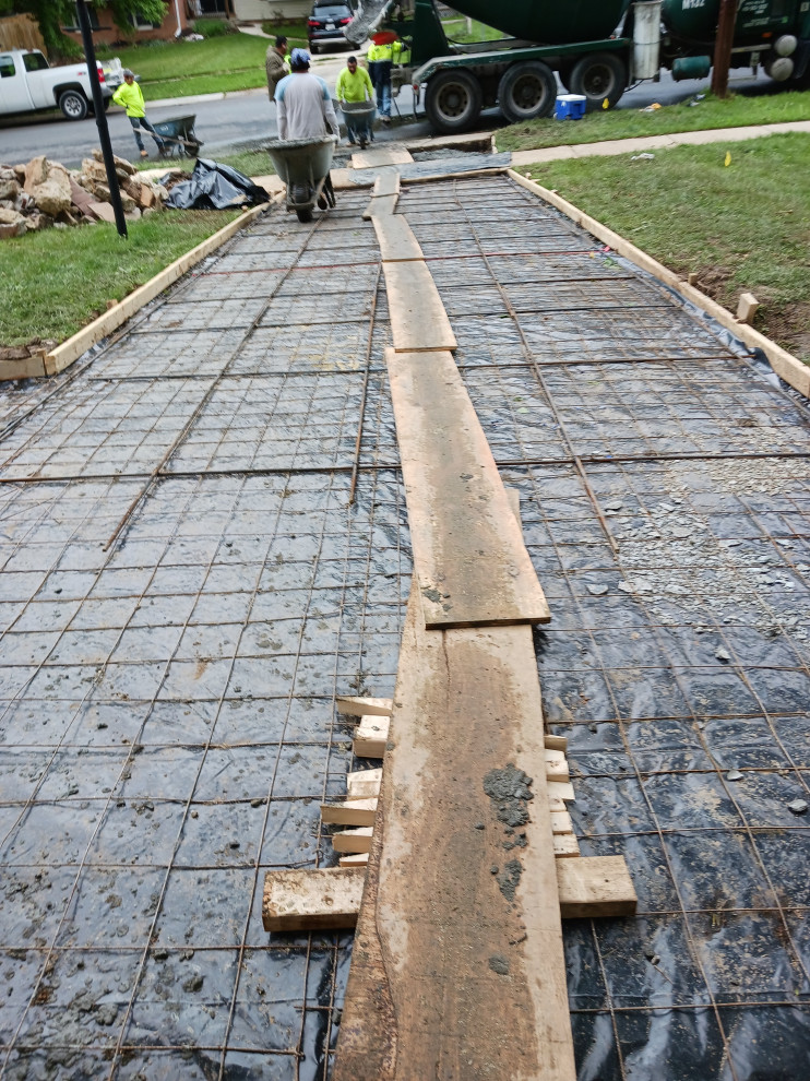 Concrete driveway , concrete patio , steps ,and landing