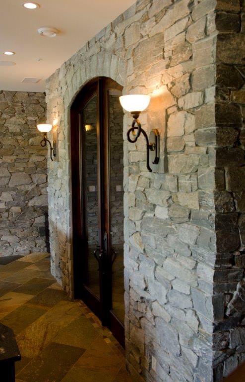 Example of a large mountain style wine cellar design