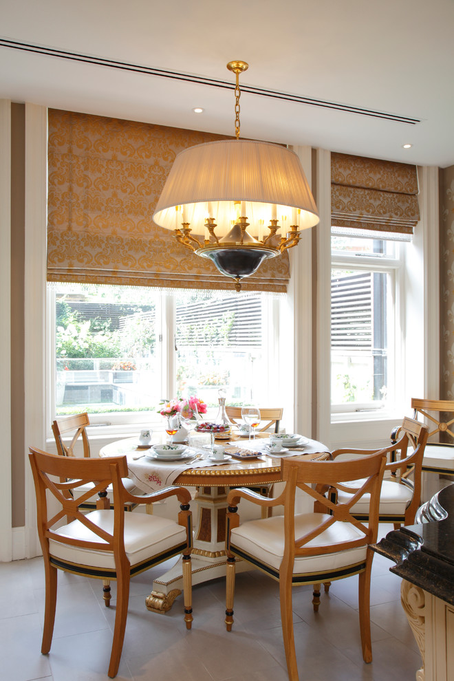 Photo of a traditional dining room in London with white walls.