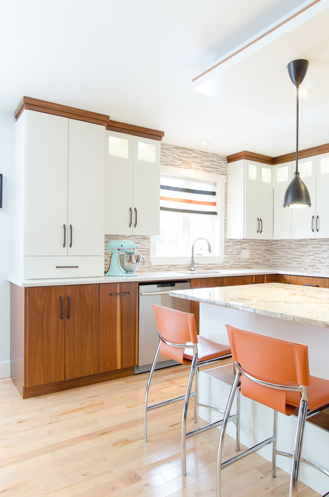Inspiration for a mid-sized transitional l-shaped light wood floor eat-in kitchen remodel with an undermount sink, flat-panel cabinets, white cabinets, granite countertops, multicolored backsplash, mosaic tile backsplash, stainless steel appliances and an island