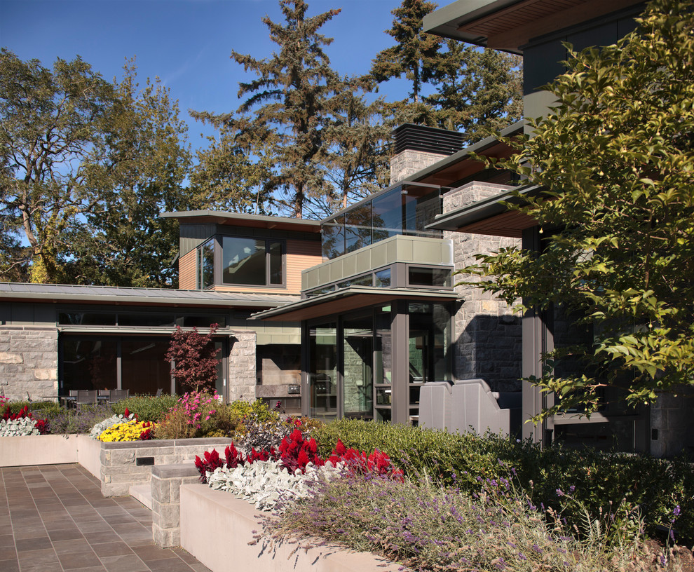 Photo of a large contemporary two-storey exterior in Vancouver.