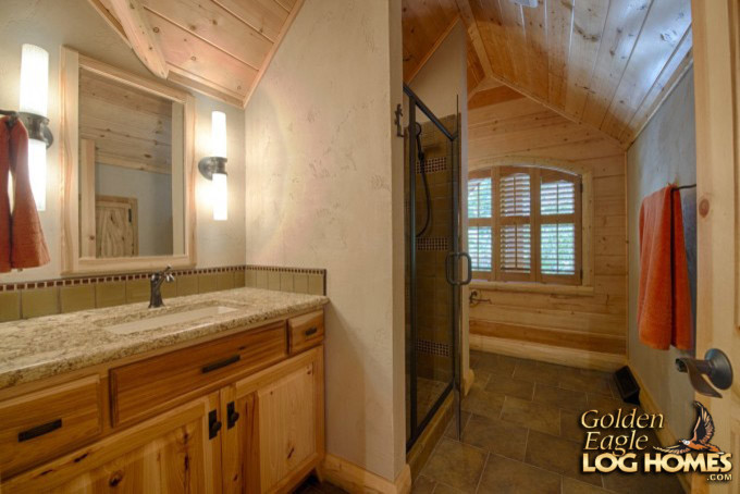 Large country bathroom in Other with medium wood cabinets, porcelain floors, granite benchtops, brown floor and multi-coloured benchtops.