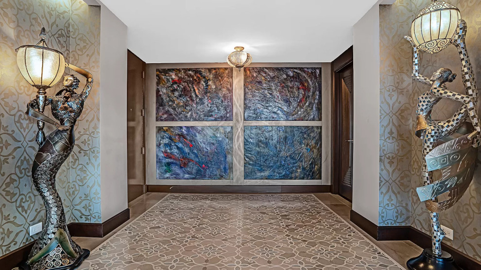 Mid-sized transitional marble floor, beige floor and wallpaper foyer photo with beige walls and a black front door