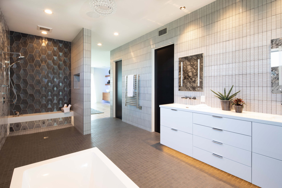 Photo of a large contemporary master bathroom in Orange County with a floating vanity, flat-panel cabinets, white cabinets, a freestanding tub, a curbless shower, porcelain floors, engineered quartz benchtops, white benchtops, a niche and a double vanity.