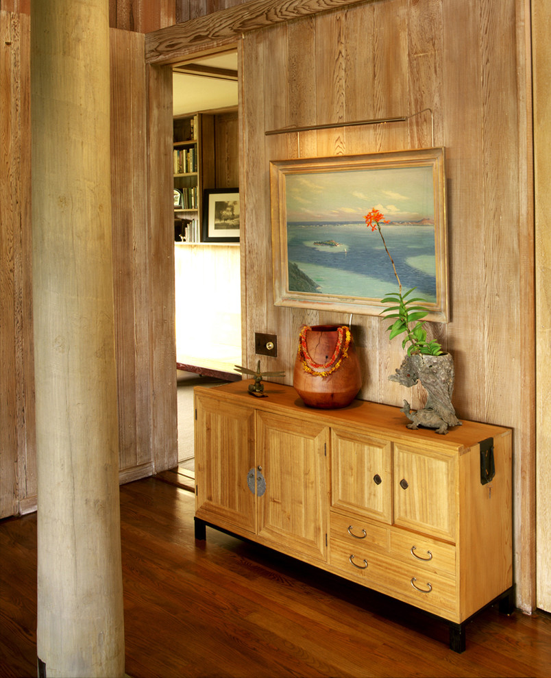 Design ideas for a tropical entryway in Hawaii with dark hardwood floors.