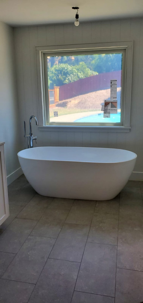 Photo of a large contemporary master bathroom in San Francisco with recessed-panel cabinets, white cabinets, a drop-in tub, pink tile, a drop-in sink, tile benchtops, pink benchtops, a double vanity and a built-in vanity.