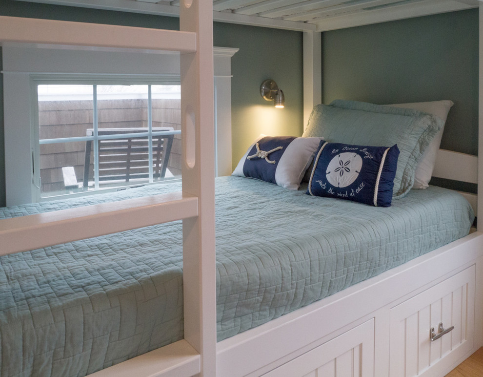 Inspiration for a mid-sized beach style guest bedroom in Providence with blue walls and light hardwood floors.