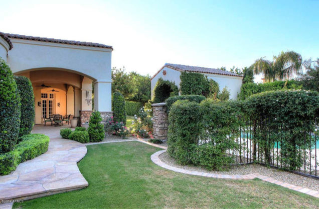 Mid-sized tuscan side yard stone and custom-shaped pool photo in Phoenix