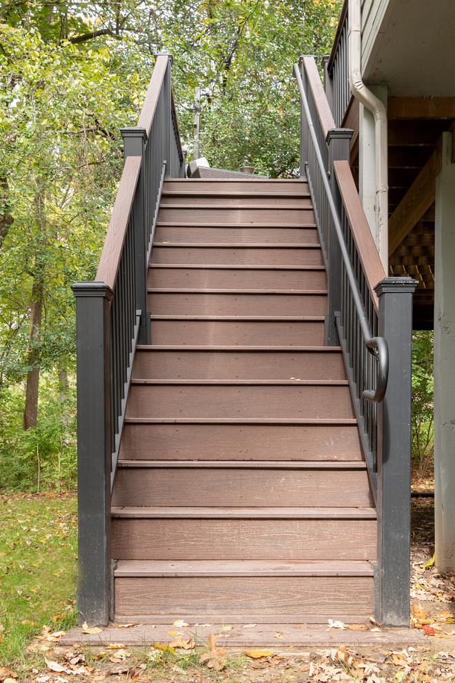 Mid-sized transitional backyard deck photo with no cover