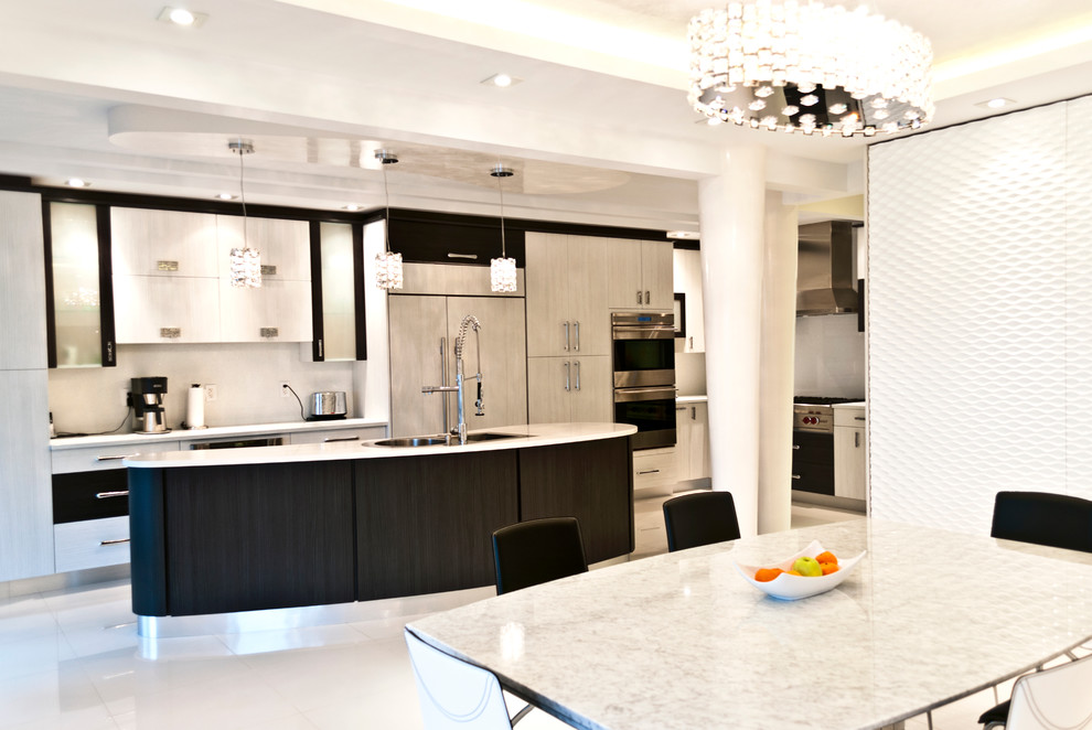 Photo of a contemporary eat-in kitchen in New York with flat-panel cabinets and panelled appliances.