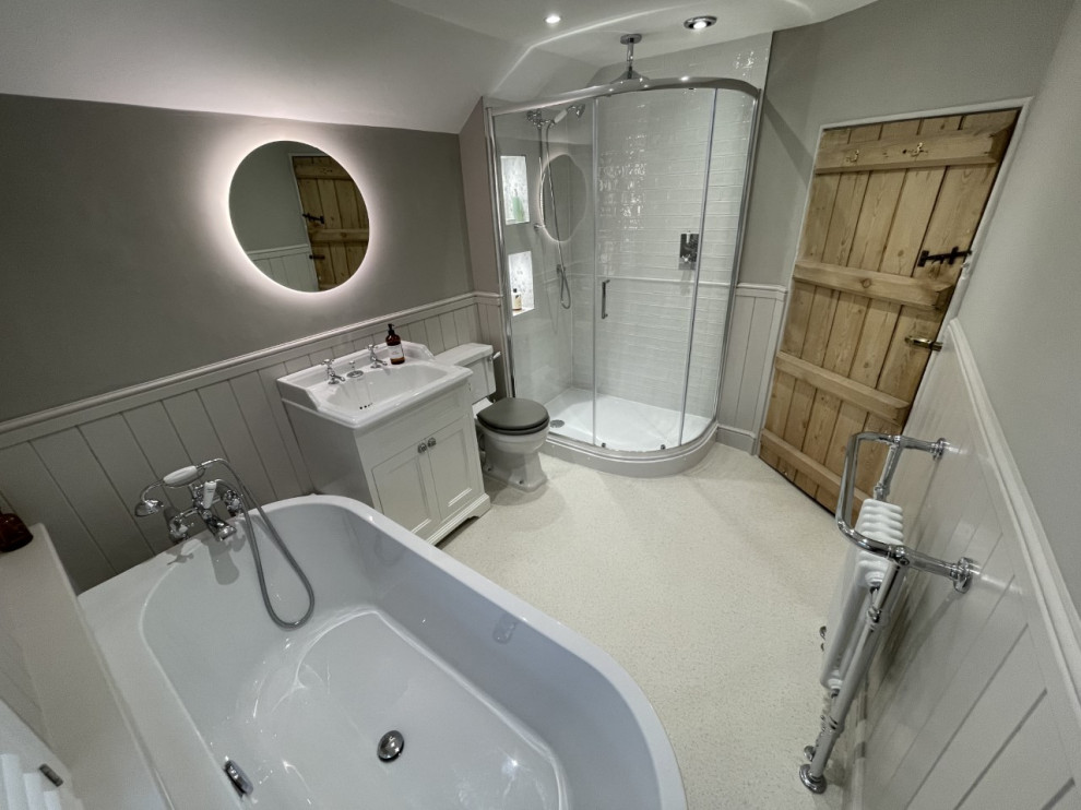 Inspiration for a medium sized classic family bathroom in Other with shaker cabinets, white cabinets, a freestanding bath, a corner shower, a sliding door, a single sink and a freestanding vanity unit.
