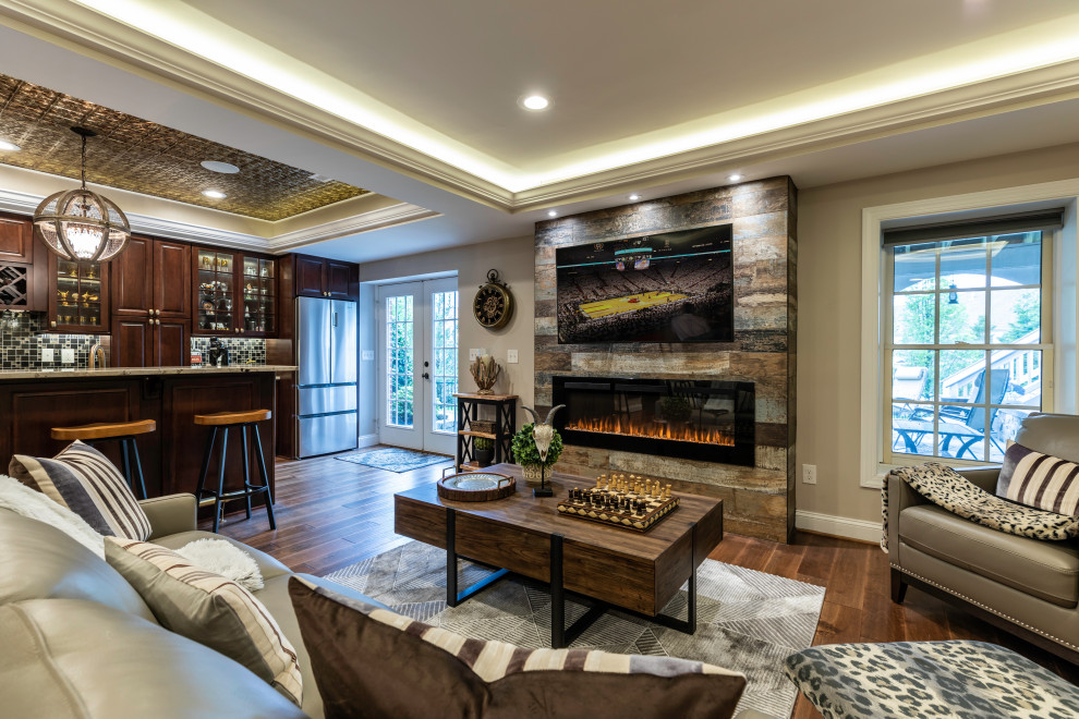 Photo of a large contemporary walk-out basement in DC Metro with a standard fireplace, brown floor, recessed and decorative wall panelling.