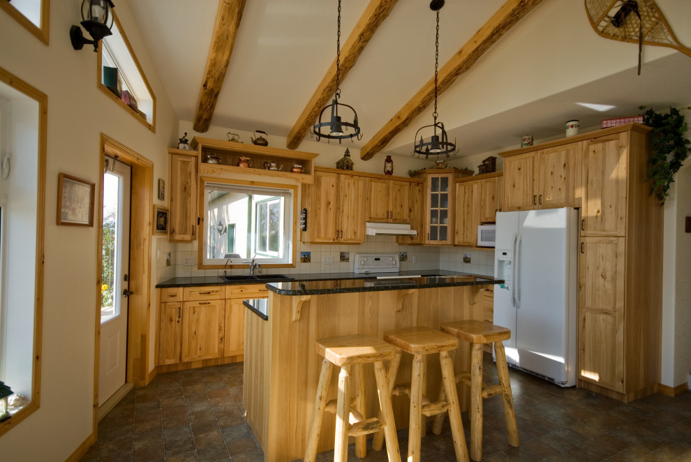 Example of a mountain style kitchen design in Calgary
