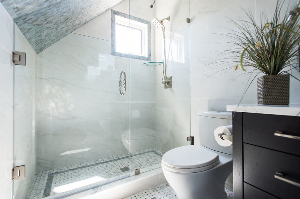 Design ideas for a mid-sized transitional 3/4 bathroom in Vancouver with an undermount sink, furniture-like cabinets, dark wood cabinets, marble benchtops, an alcove shower, a one-piece toilet, white tile, stone slab, white walls and mosaic tile floors.