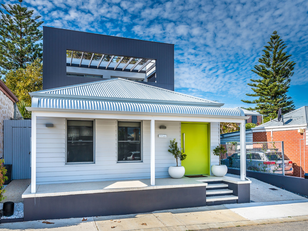 Photo of a small contemporary two-storey white exterior in Perth.