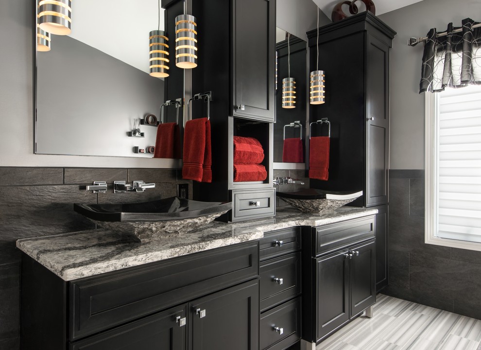 Large contemporary master bathroom in Detroit with recessed-panel cabinets, black cabinets, an alcove shower, gray tile, grey walls, marble floors, a vessel sink, a drop-in tub, a two-piece toilet, ceramic tile, engineered quartz benchtops, multi-coloured floor, a hinged shower door and multi-coloured benchtops.