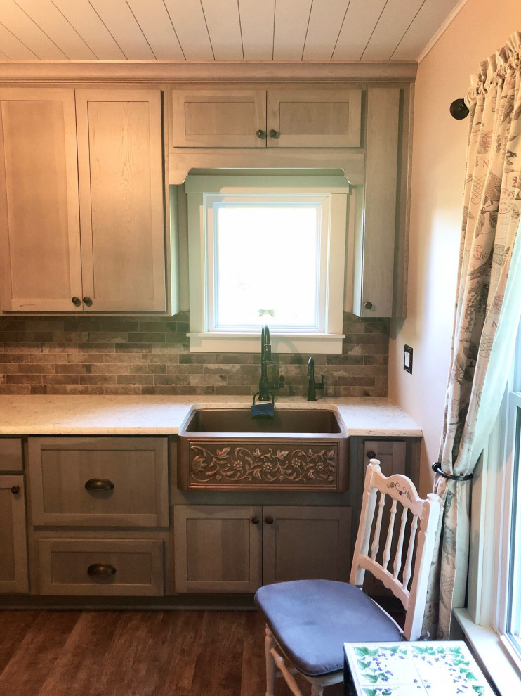 Photo of a small country u-shaped separate kitchen in Detroit with a farmhouse sink, shaker cabinets, grey cabinets, quartz benchtops, brown splashback, ceramic splashback, white appliances, cork floors, no island, brown floor, white benchtop and timber.