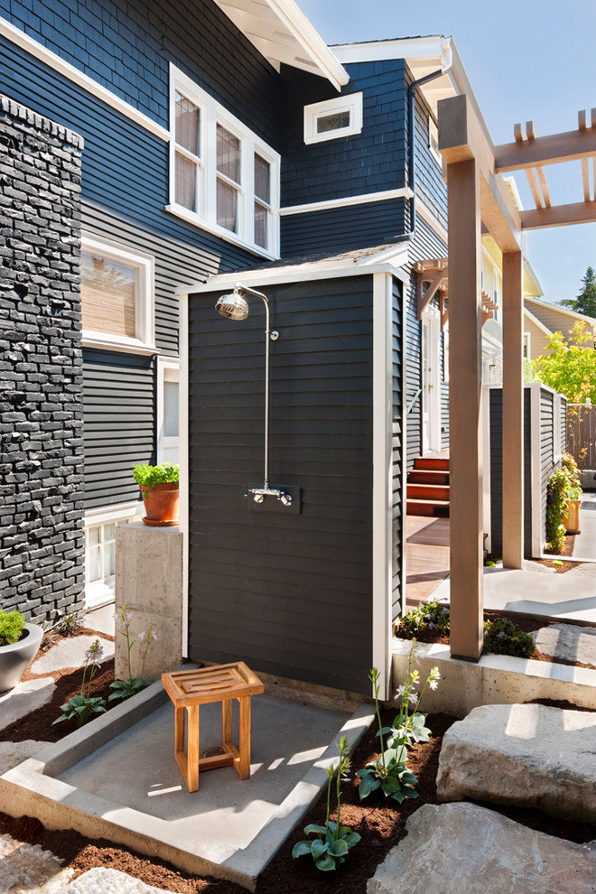 This is an example of a transitional patio in Seattle with an outdoor shower.