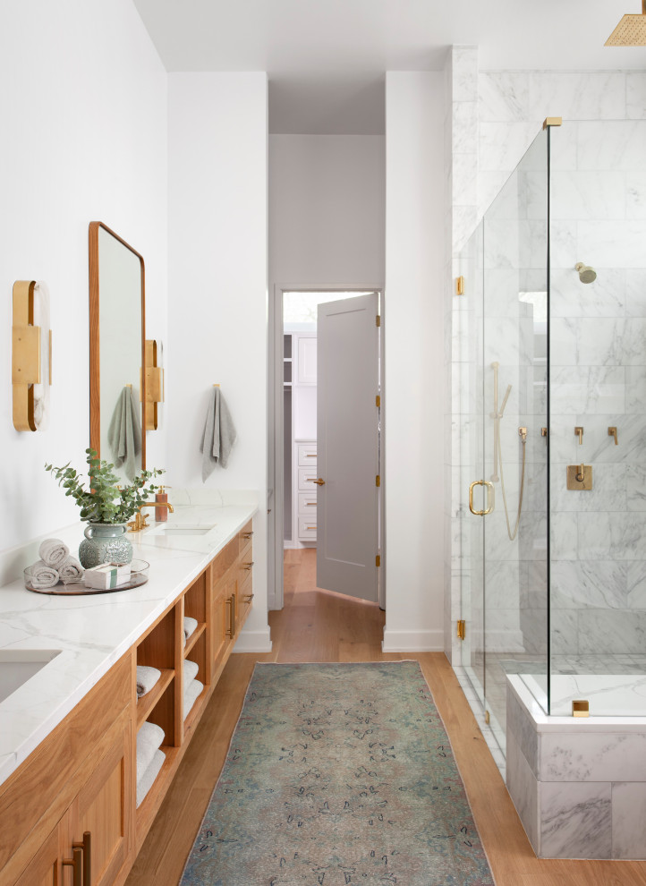 Mid-sized contemporary master wet room bathroom in Austin with shaker cabinets, medium wood cabinets, a freestanding tub, a one-piece toilet, white tile, white walls, an undermount sink, granite benchtops, a hinged shower door, white benchtops, a double vanity and a built-in vanity.