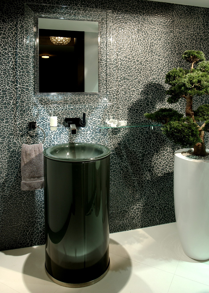 Photo of a contemporary powder room in Miami with a pedestal sink.