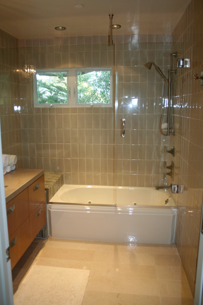 This is an example of a small midcentury bathroom in San Francisco with flat-panel cabinets, medium wood cabinets, marble benchtops, a corner tub, beige tile, ceramic tile, green walls and marble floors.