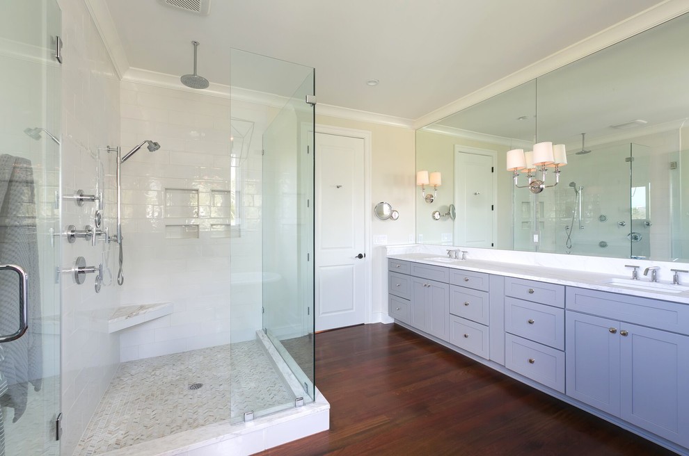 Large modern master bathroom in Charleston with a freestanding tub, a corner shower, white tile, porcelain tile, white walls, dark hardwood floors, an undermount sink, quartzite benchtops, brown floor, a hinged shower door, recessed-panel cabinets and grey cabinets.