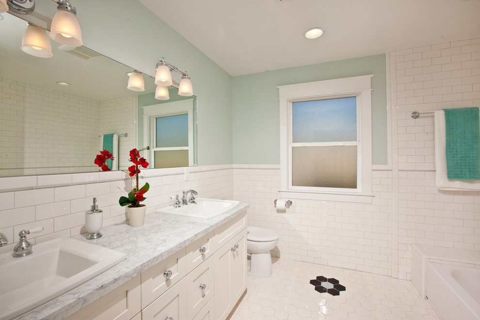 Design ideas for a traditional bathroom in San Diego with marble benchtops.