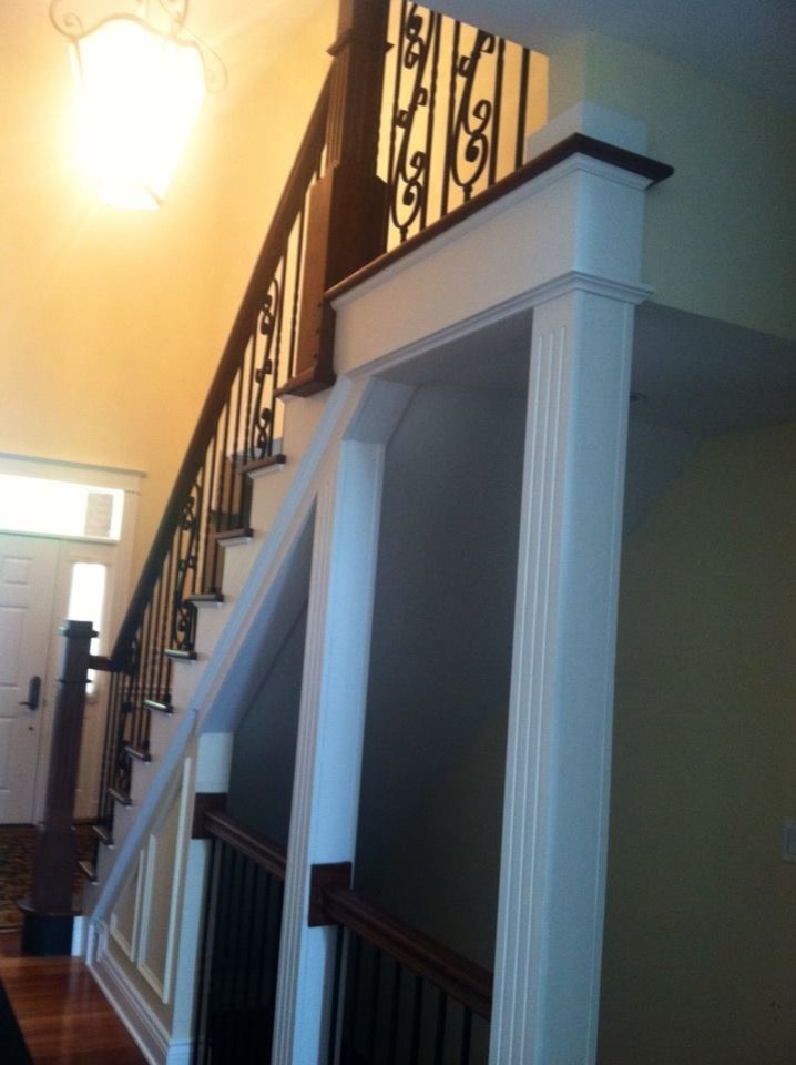 Dr. Gabe, Stairway, entry, After; New paint, stain, banisters and Wrought iron g