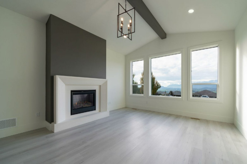 Living room - mid-sized craftsman open concept laminate floor, beige floor and shiplap ceiling living room idea in Vancouver with white walls, a standard fireplace, a wood fireplace surround and a wall-mounted tv