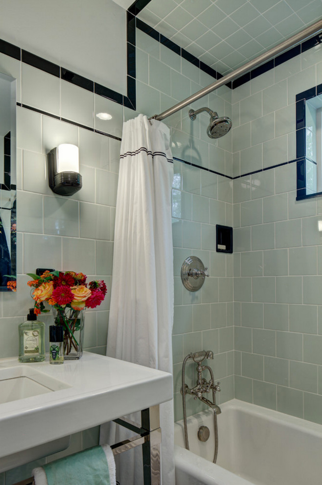 Inspiration for a mid-sized arts and crafts bathroom in Los Angeles with glass-front cabinets, yellow cabinets, an alcove tub, a shower/bathtub combo, a two-piece toilet, green tile, subway tile, green walls and a console sink.