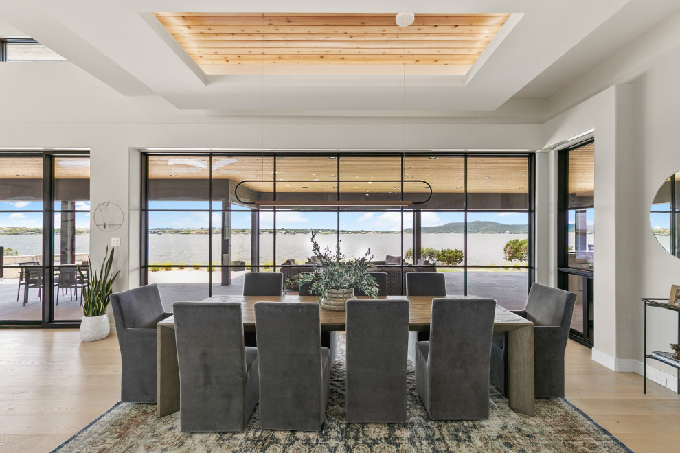 Large beach style dining room in Dallas.
