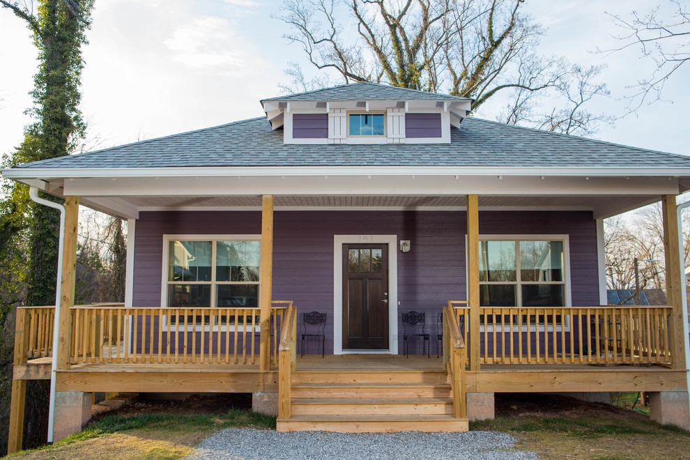 Photo of a mid-sized arts and crafts one-storey purple house exterior in Other.