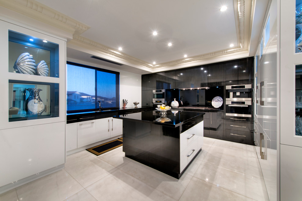 Inspiration for a large mediterranean u-shaped kitchen in Perth with glass-front cabinets, white cabinets, granite benchtops, black splashback, glass sheet splashback, black appliances and with island.