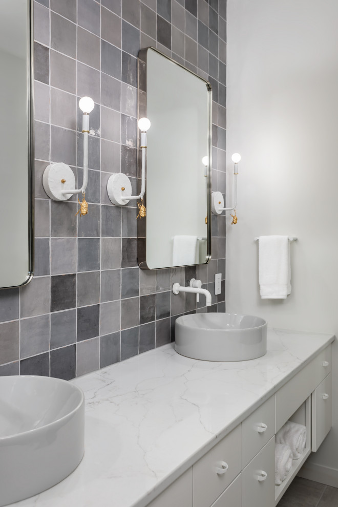 Large contemporary bathroom in Other with flat-panel cabinets, white cabinets, grey tiles, white walls, a vessel sink, white worktops, double sinks and a floating vanity unit.