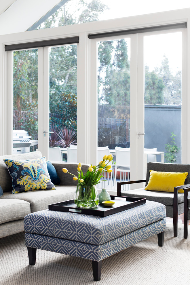 This is an example of a mid-sized contemporary open concept living room in Melbourne.