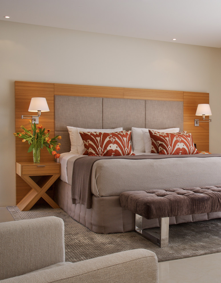 Photo of a contemporary master bedroom in Brisbane with beige walls.