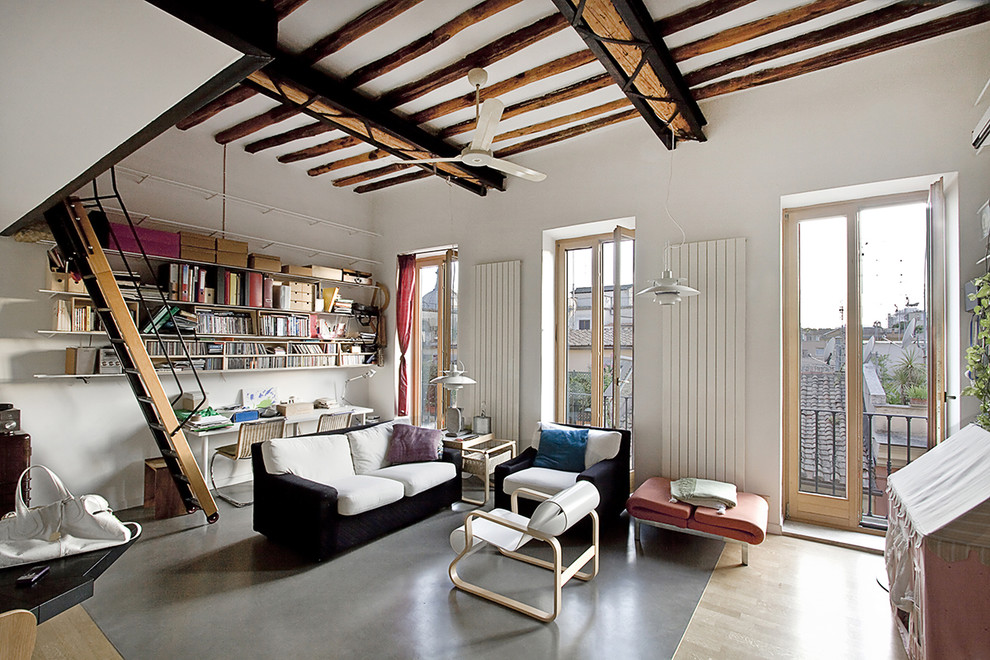 Inspiration for a scandinavian living room in Milan with white walls, light hardwood floors, no fireplace and no tv.