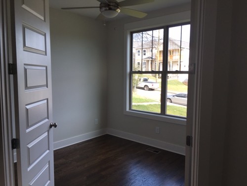 Small (10x10 w/one diagonal wall) home office off foyer/entrance.