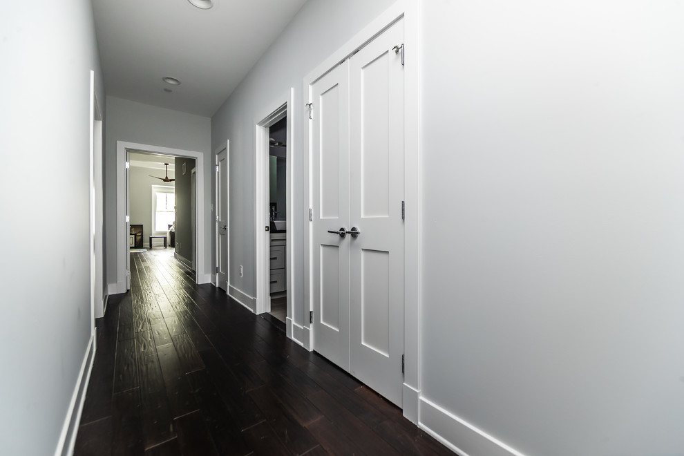 Design ideas for a large arts and crafts hallway in Baltimore with grey walls, dark hardwood floors and brown floor.