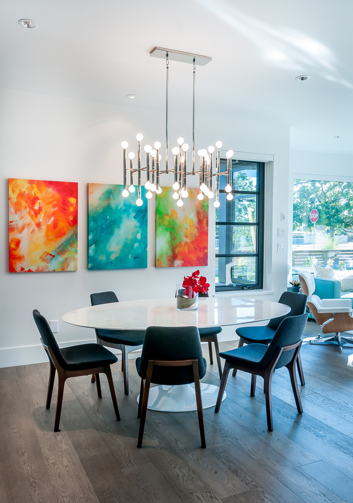 Mid-sized contemporary open plan dining in Vancouver with white walls, medium hardwood floors and no fireplace.