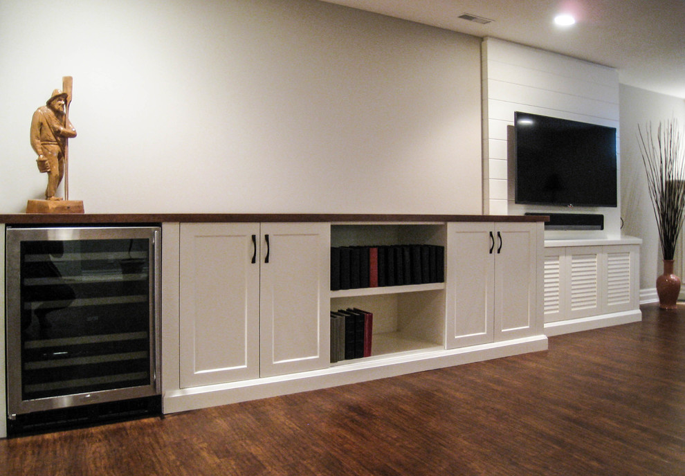 Example of a transitional vinyl floor and brown floor basement design in Toronto with gray walls