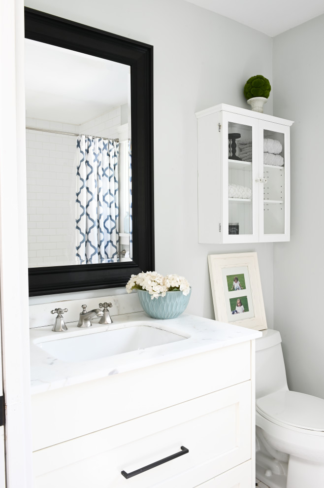 Inspiration for a small transitional 3/4 single-sink bathroom remodel in Vancouver with shaker cabinets, white cabinets, a one-piece toilet, gray walls, an undermount sink, white countertops and a built-in vanity
