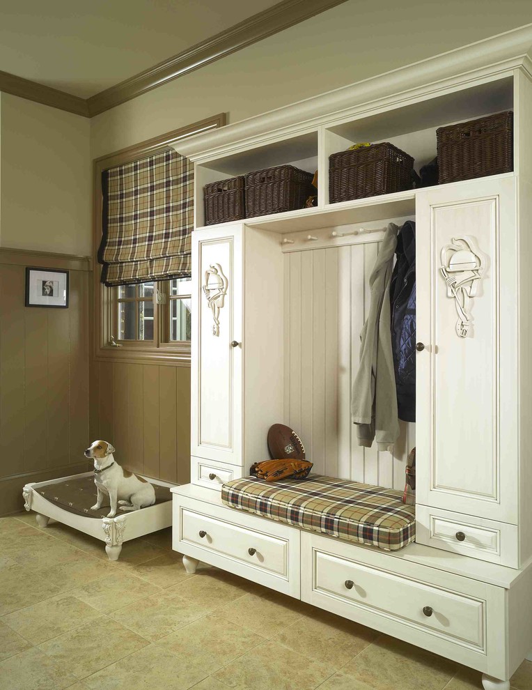 Photo of a mid-sized traditional mudroom in Atlanta with brown walls, porcelain floors and beige floor.