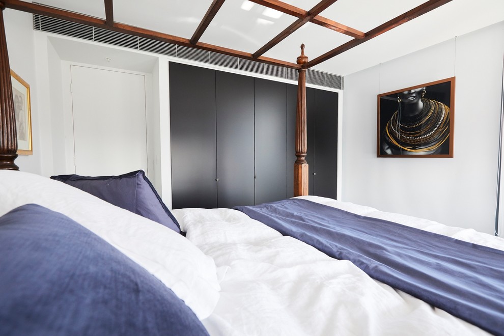 Photo of a mid-sized contemporary master bedroom in Sydney with white walls, carpet and grey floor.