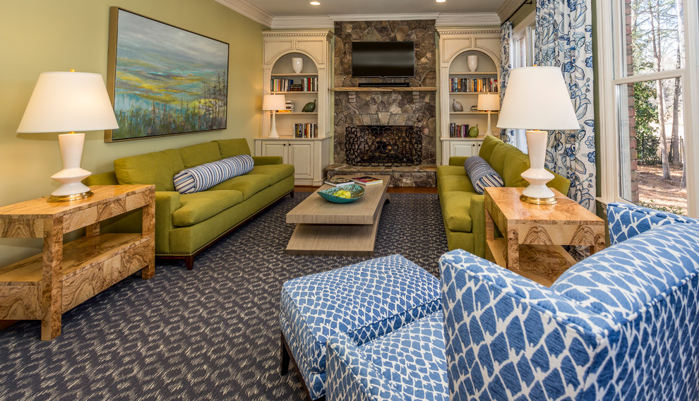 Mid-sized traditional enclosed living room in Charlotte with beige walls, dark hardwood floors, a standard fireplace, a stone fireplace surround, a wall-mounted tv and blue floor.