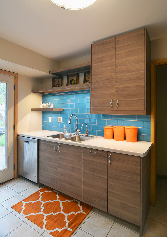 Design ideas for a small midcentury u-shaped kitchen in Minneapolis with flat-panel cabinets and a peninsula.