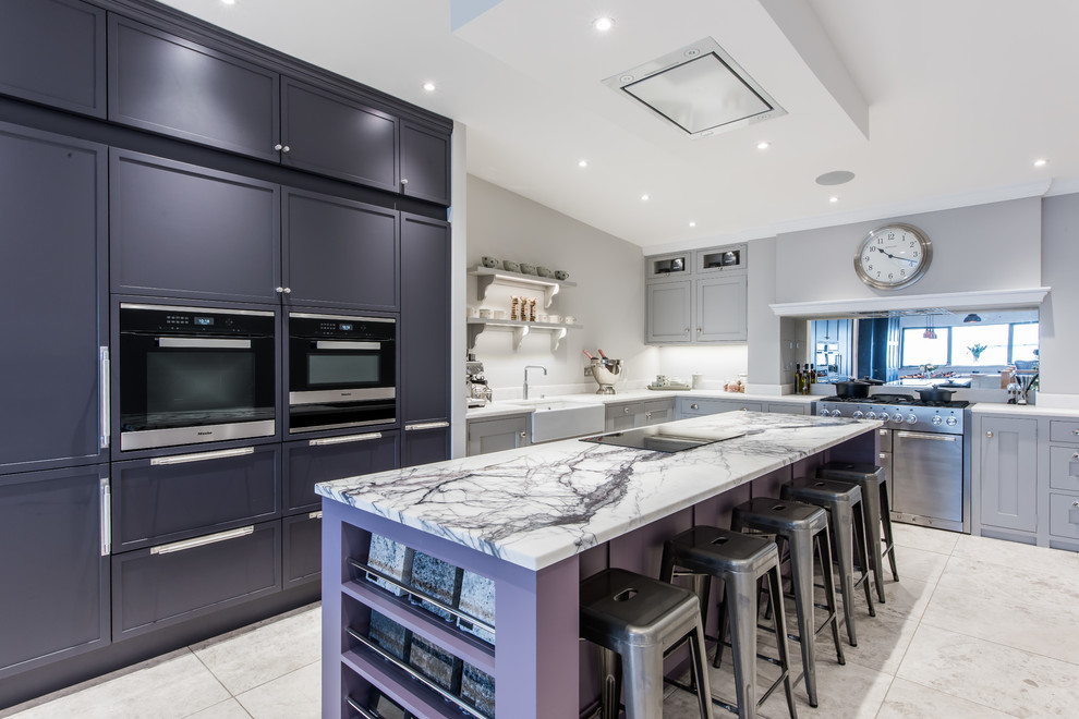 This is an example of a large contemporary l-shaped open plan kitchen in Other with a farmhouse sink, marble benchtops, metallic splashback, mirror splashback, marble floors, with island and white floor.