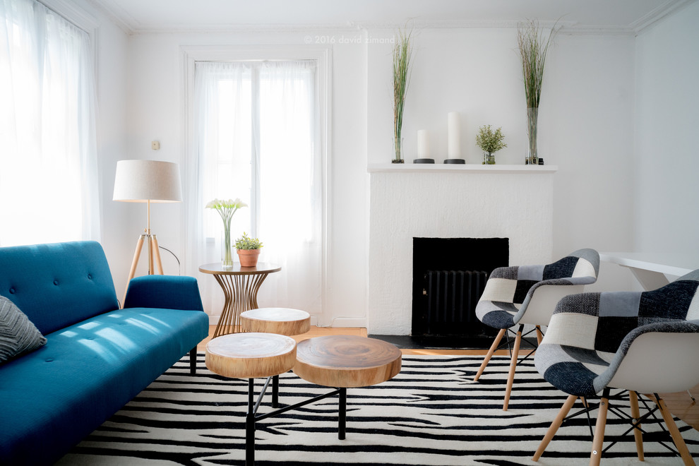 Living room - contemporary formal living room idea in New York with white walls and a standard fireplace